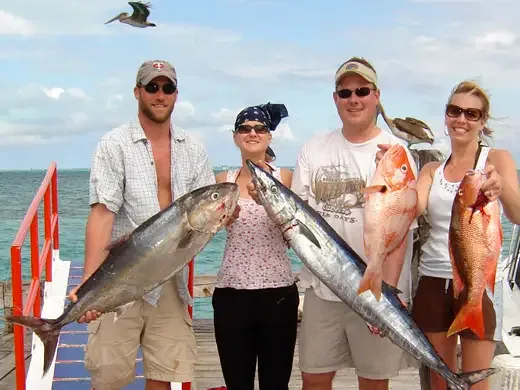 Group of anglers with their catch after deep sea fishing in Cancun