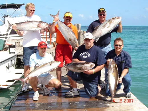 Group of anglers with their catch after deep sea fishing in Cancun