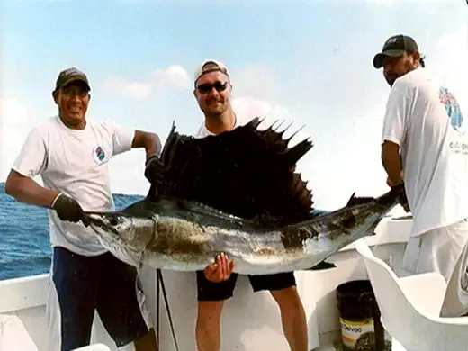 Angler with a sailfish caught while fishing in Cancun
