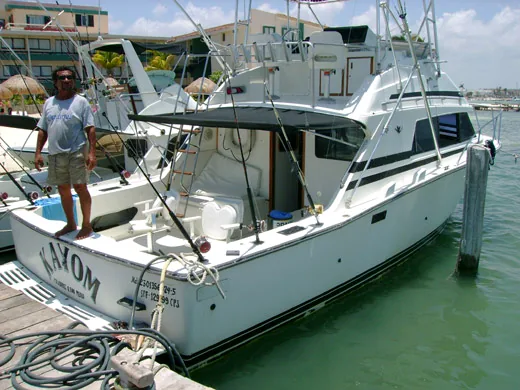 Cancun sportfishing charter boat viewed from the stern at the dock