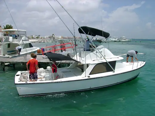 Heavy-duty conventional trolling rods deployed from a sportfisher targeting trophy Blue Marlin and Sailfish